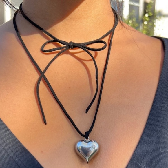 Puffed heart pendant on a long black wrap around cord necklace. - Picture 2 of 4